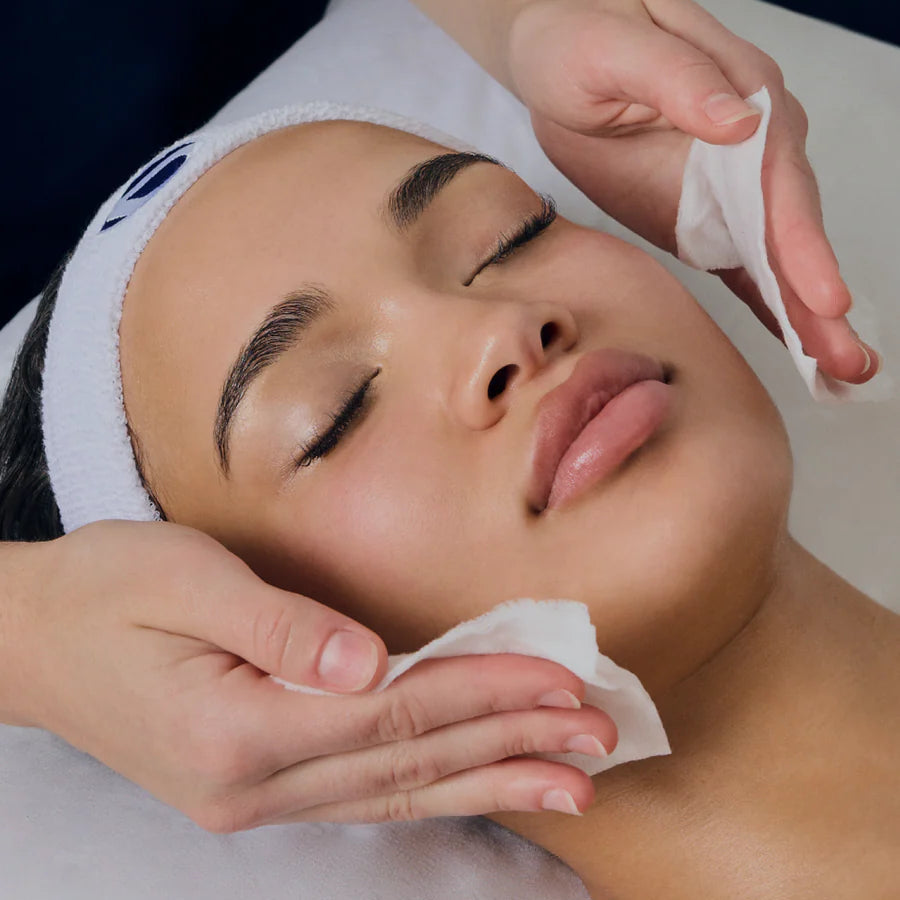 Person receiving a facial treatment with a focus on skincare.
