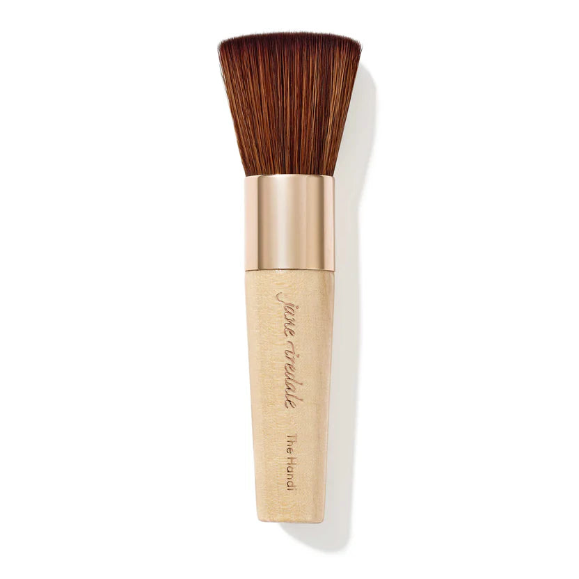 Makeup brush with wooden handle and beige shaft on a white background