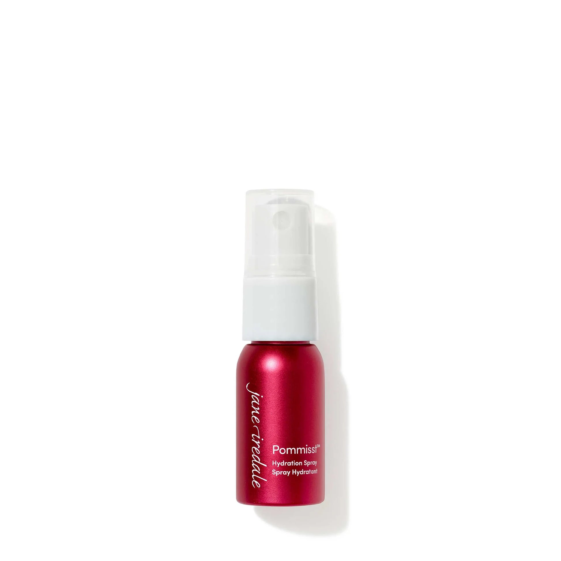 Red spray bottle with white cap on a white background
