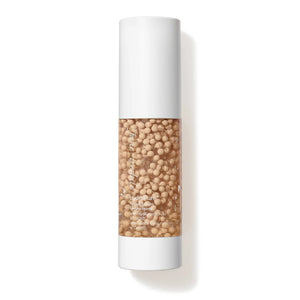 Jane Iredale HydroPure Tinted Serum in Fair 1, a clear pump bottle showing the tinted formula.