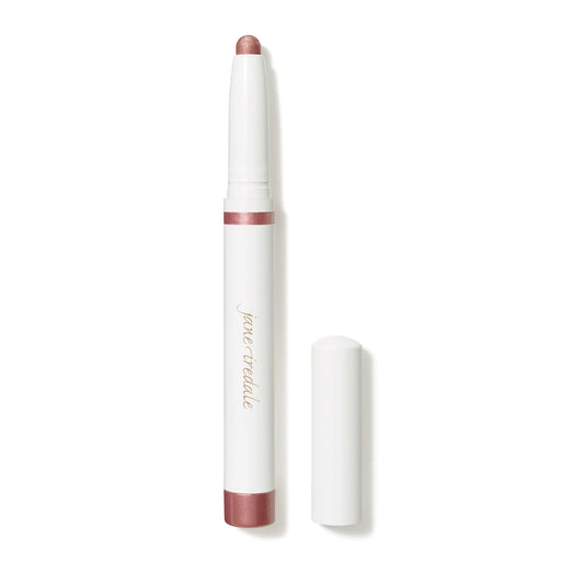 A cream-to-powder eye shadow stick in a matte pink shade, with a built-in sharpener, displayed next to its cap.