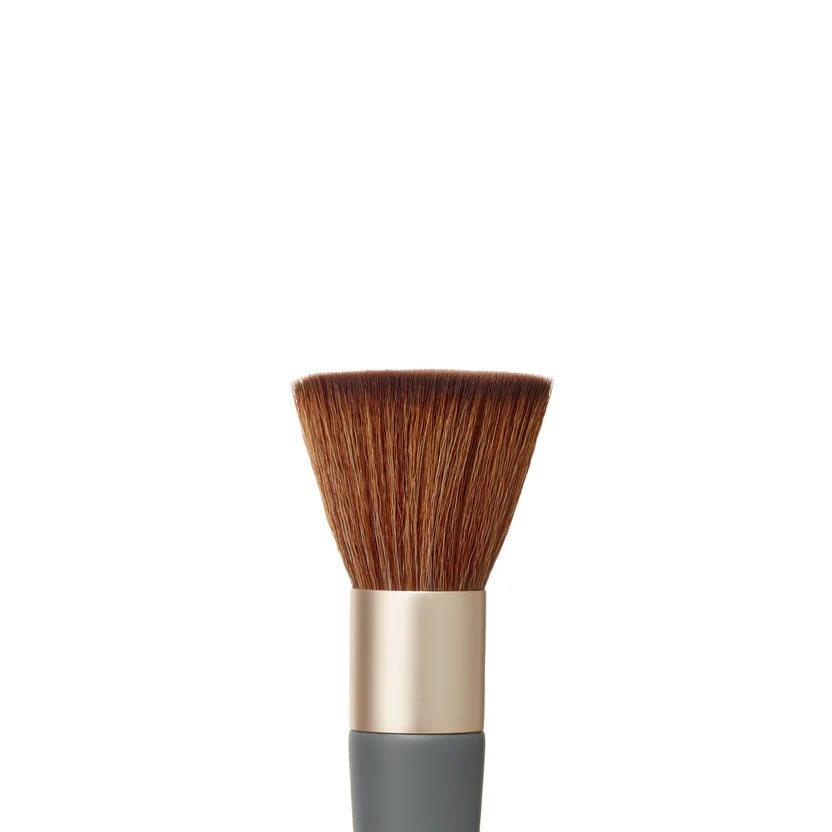 Makeup brush with brown bristles and a gray handle on a white background