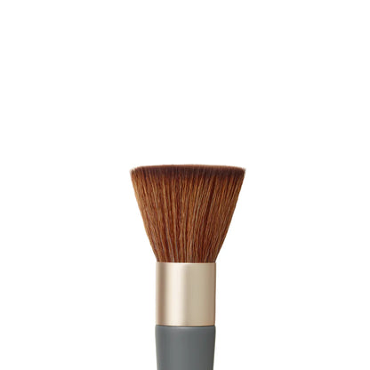 Makeup brush with brown bristles and a gray handle on a white background