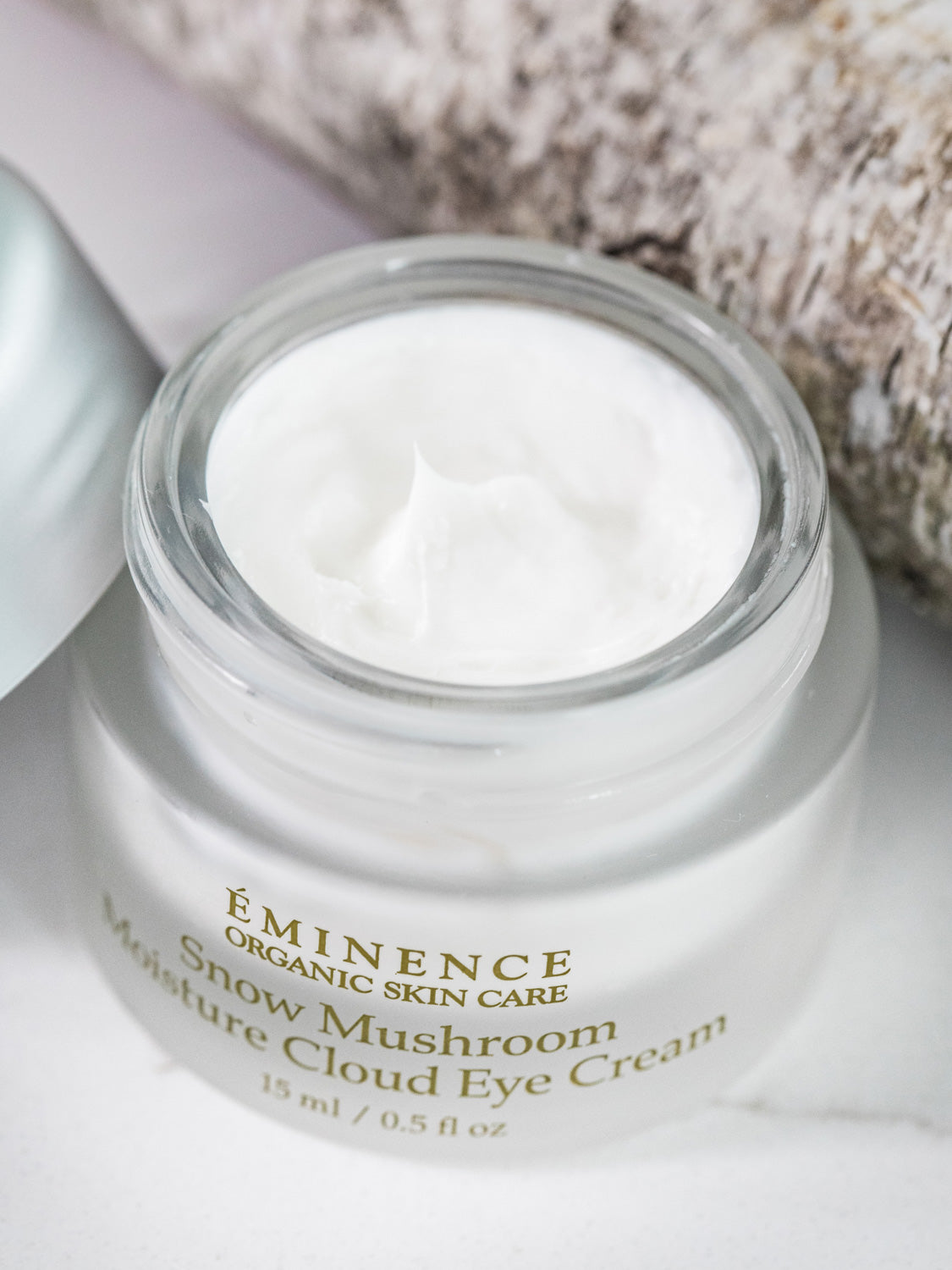 Eminence Snow Mushroom Moisture Cloud Eye Cream jar with cream visible on top