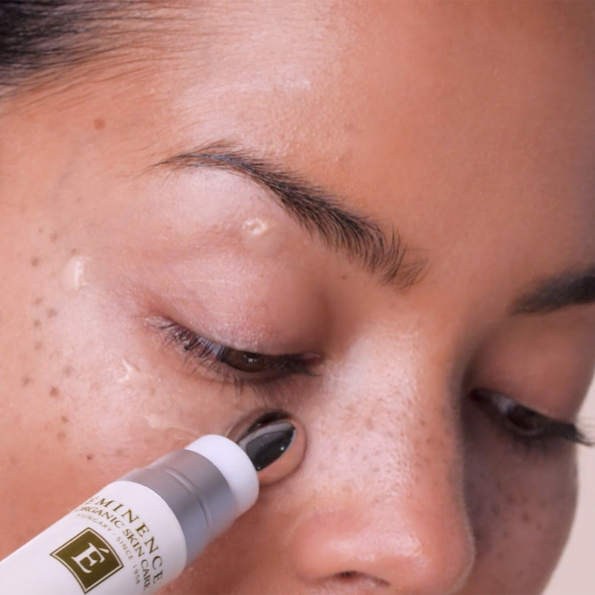 Model close-up of the eye area from the Eminence Vitamin C+ Eye Cream campaign.