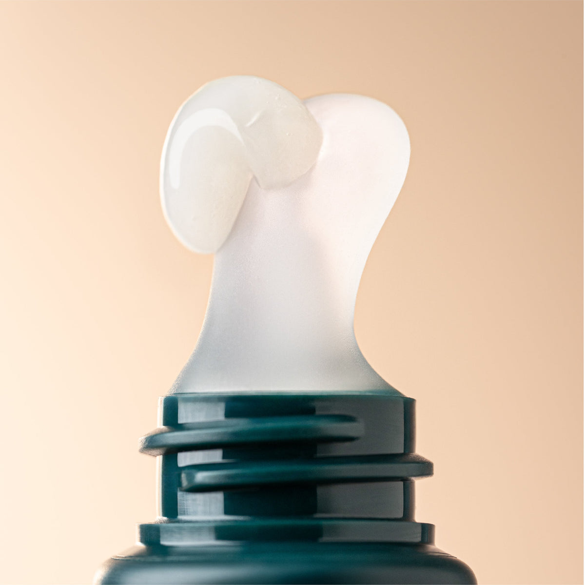 Close-up of the Irene Forte Bio-Peptide Lip Treatment applicator with product