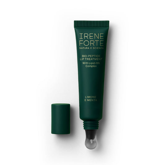 Irene Forte Bio-Peptide Lip Treatment, a green tube with applicator, on a white background