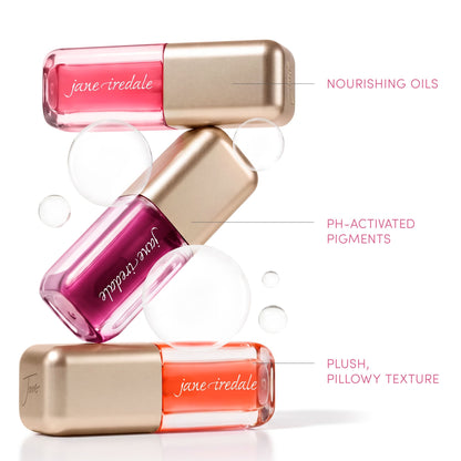 Jane Iredale graphic of three Just Kissed pH Lip Oils labeled nourishing oils, pH-activated pigments and plush, pillowy texture.