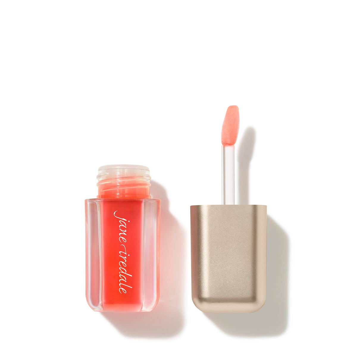 Jane Iredale Just Kissed pH Lip Oil in Blooming Peach, uncapped with the applicator beside it.