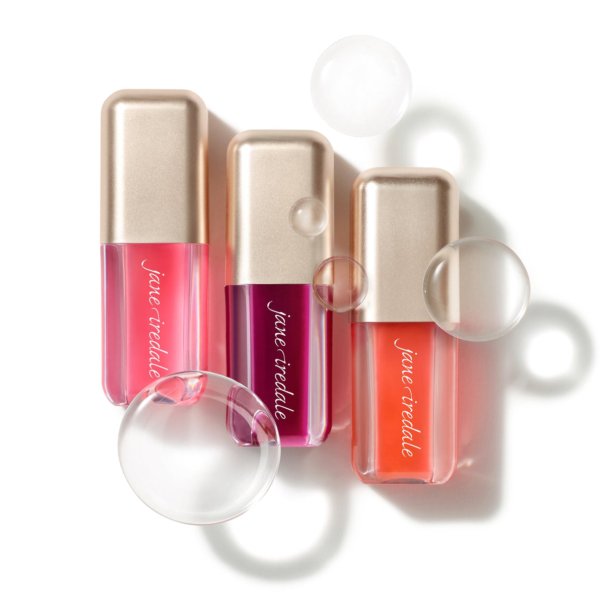 All three shades of Jane Iredale Just Kissed pH Lip Oil together: Blooming Pink, Blooming Berry and Blooming Peach.