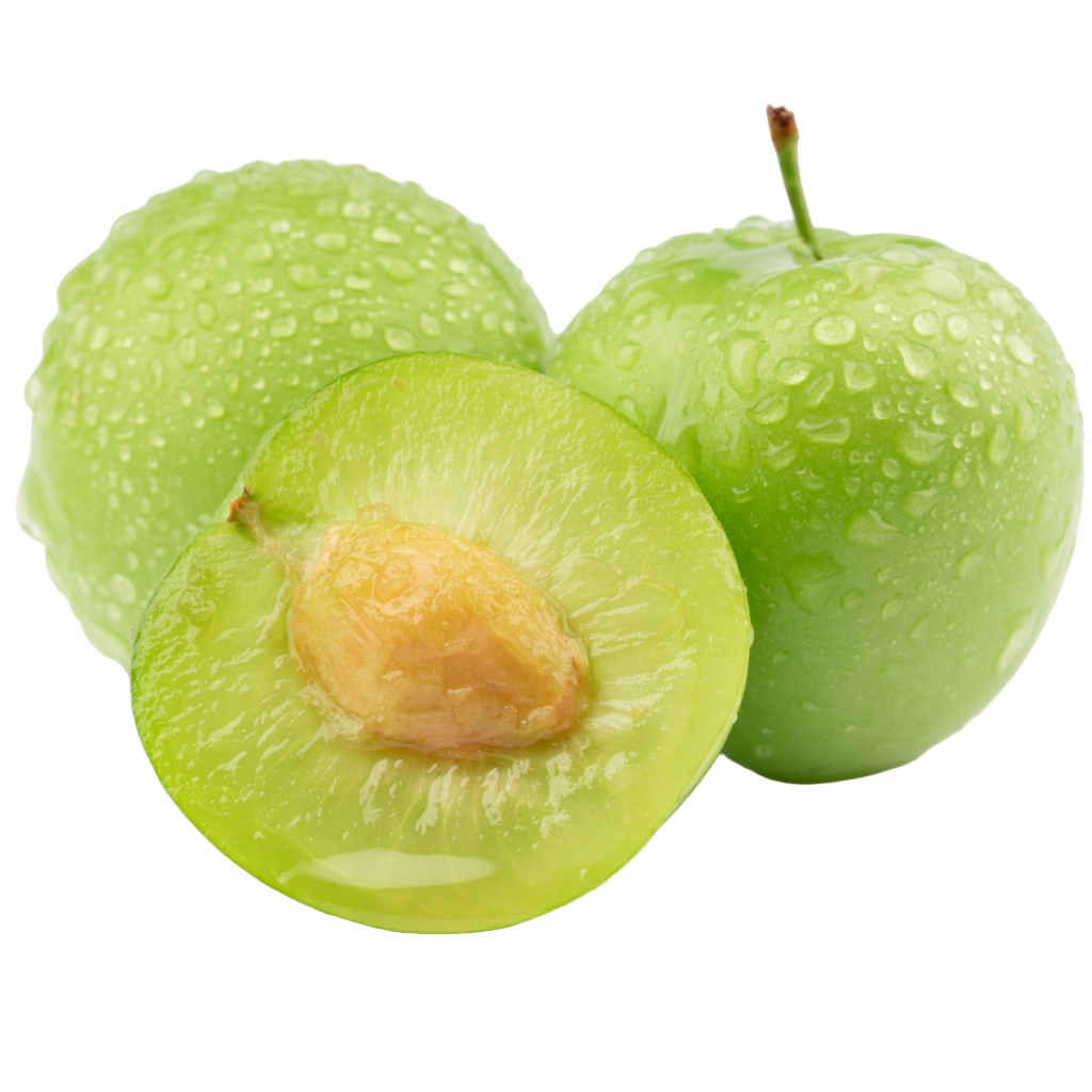 Green fruit with a cut half showing the interior on a white background