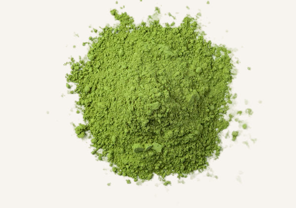 Green powder on a white background