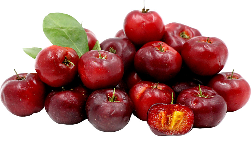 Pile of red fruits with a halved fruit showing yellow interior on a white background
