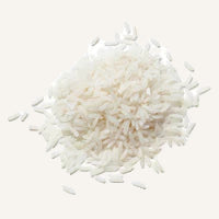 Close-up of a pile of white rice on a white background