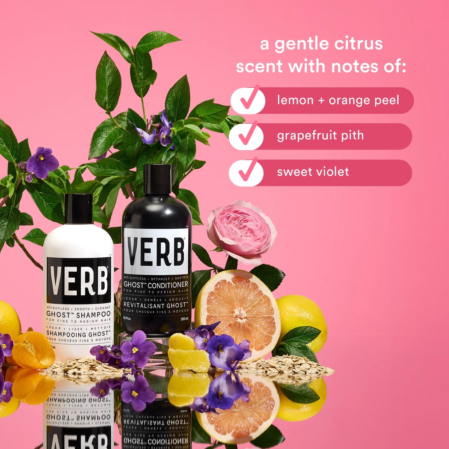 VERB shampoo and conditioner bottles with floral and citrus elements on a pink background