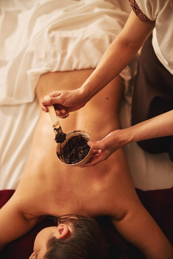 Person receiving a cupping therapy treatment on their back.