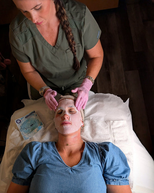 Client wearing the post-treatment mask after microchanneling, with the ProCell recovery kit beside her